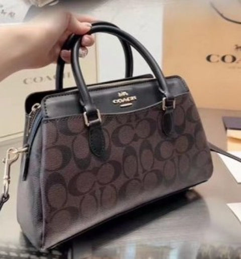 Coach Darcie carryall signature bag with dust cover